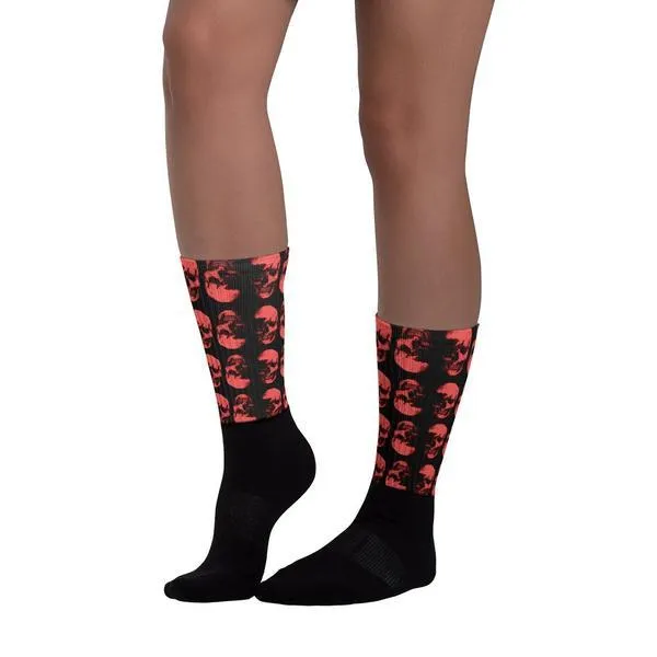 Red Skulls Opposites Socks by Robert Bowen