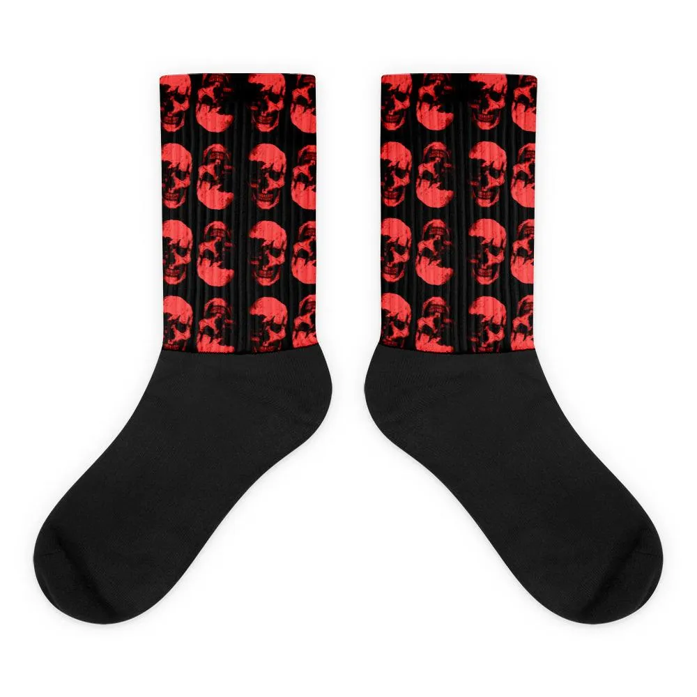 Red Skulls Opposites Socks by Robert Bowen