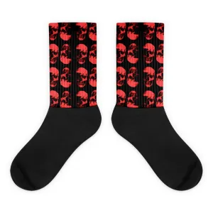 Red Skulls Opposites Socks by Robert Bowen