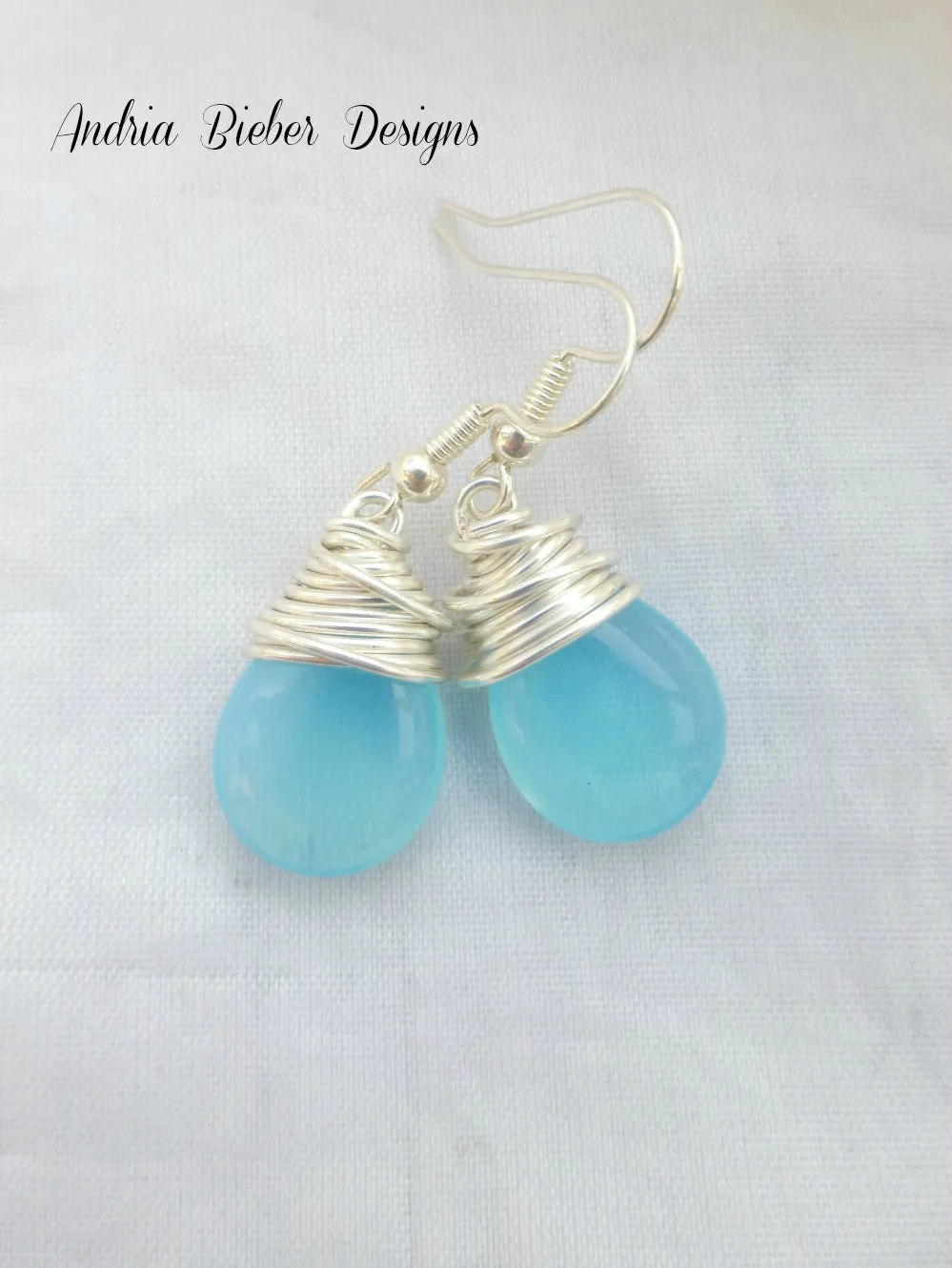 Sky blue transparent teardrop Czech Picasso glass, silver wire wrapping, sterling silver earrings.